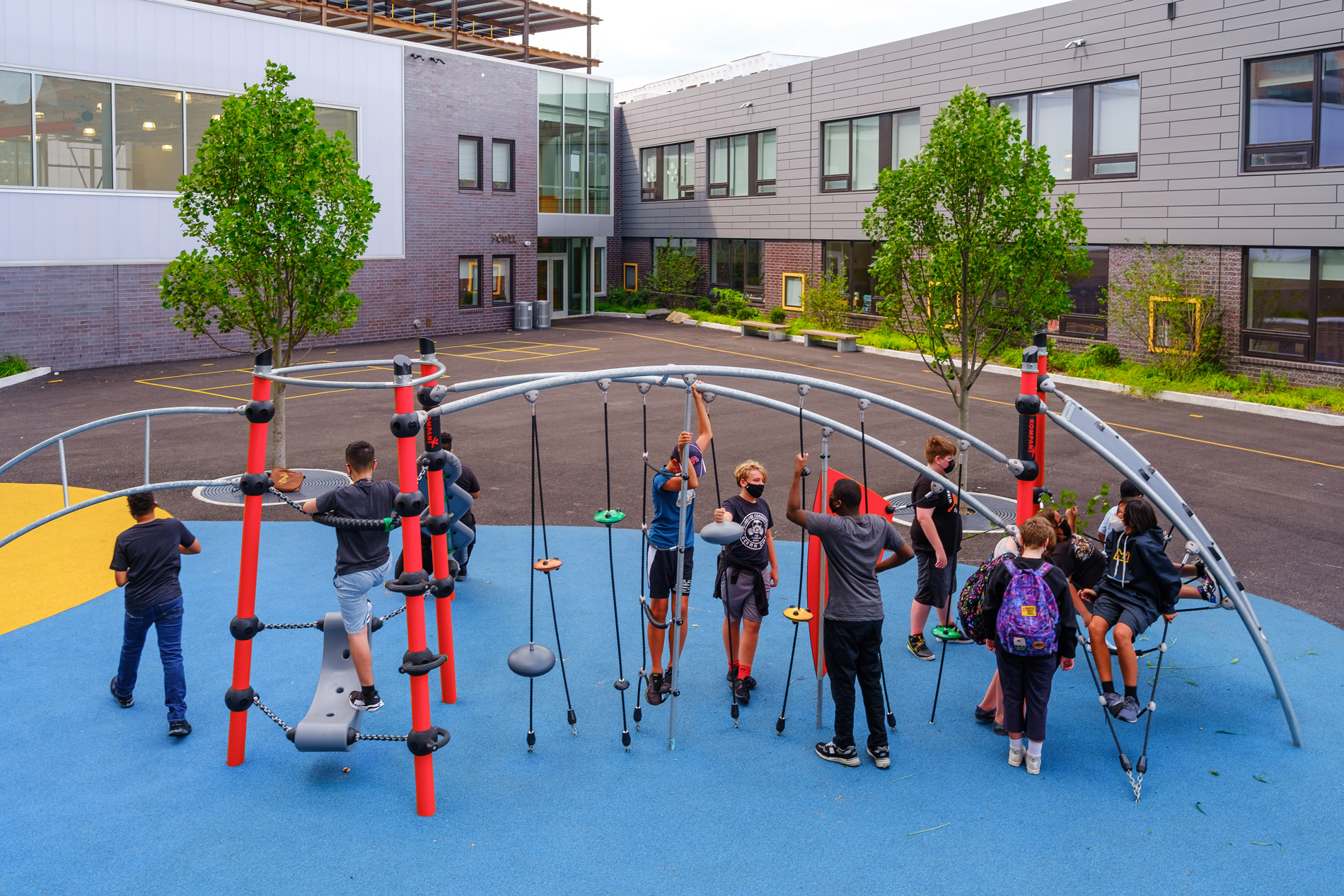 Samuel Powel Elementary School exterior with students playing.
